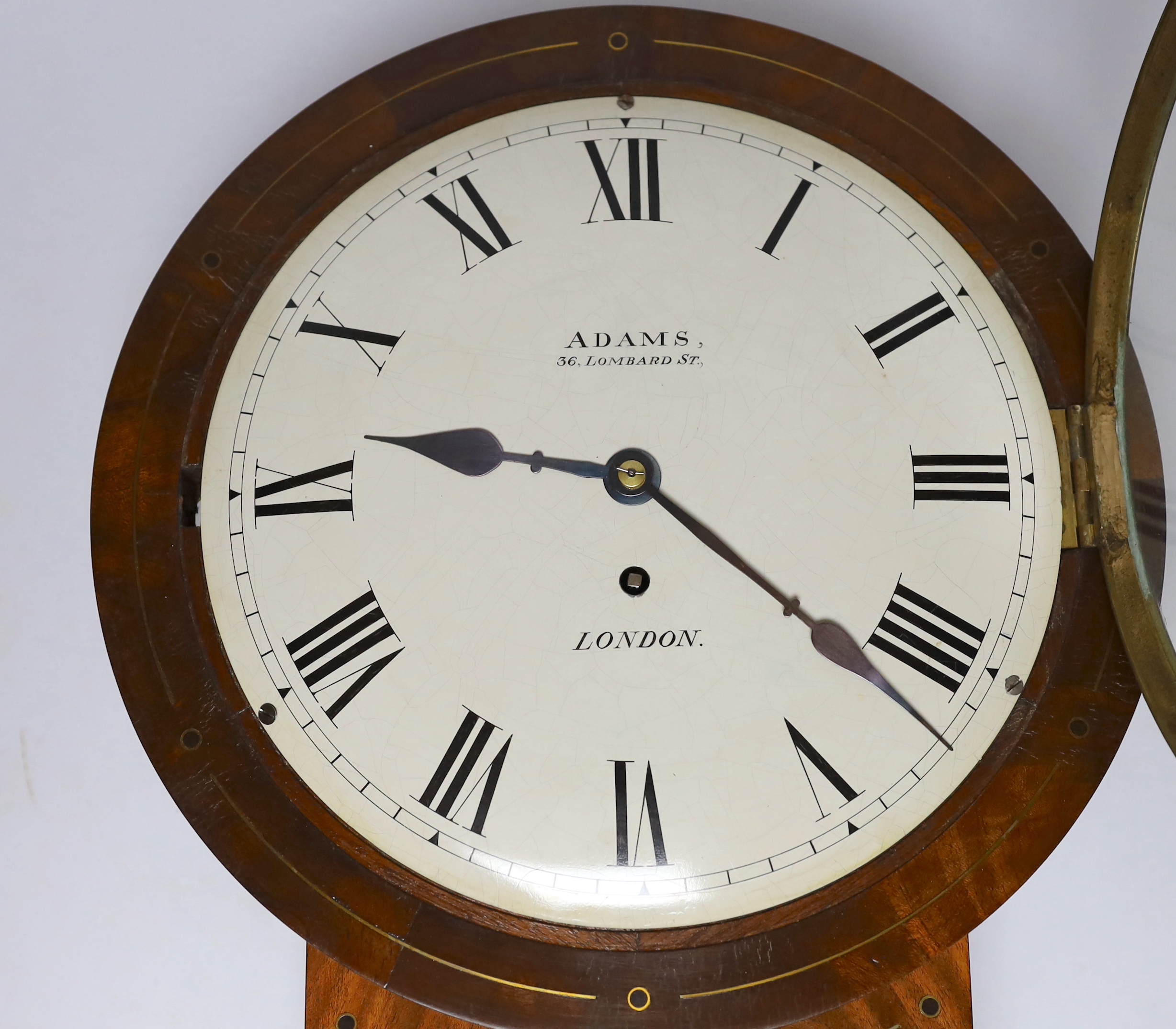 Adams, London. A Regency brass inlaid mahogany single fusee convex wall dial, 40cm high